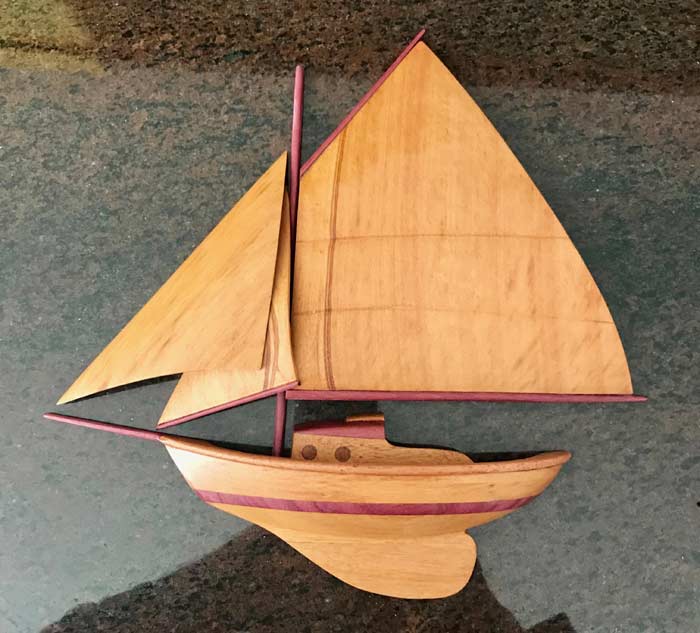 Wood carving sailboat sculpture by Artist Domingos Edral