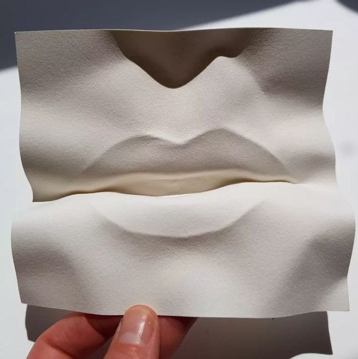 Lips in folded paper