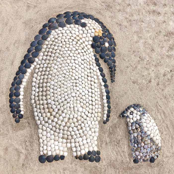Create a Penguin in the sand with seashells