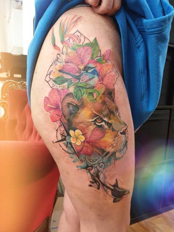 Amazing tattoo art on thigh by Jess Hannigan