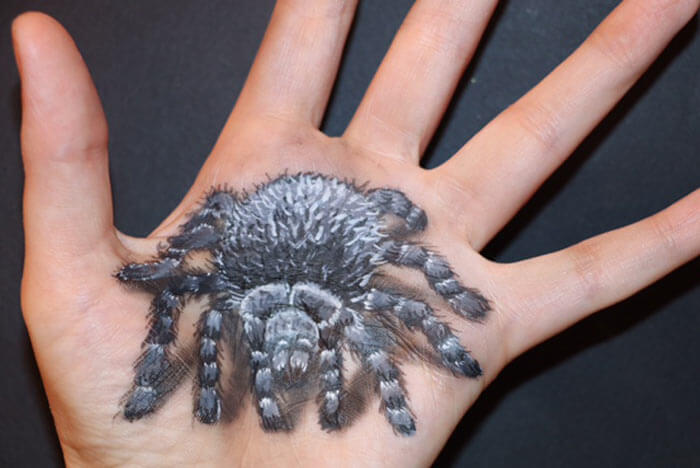 Spider painted on hand by Artist Elena