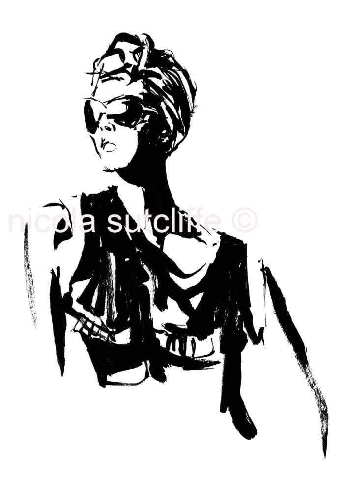 Creative workspace of a fashion illustrator with brushes and inks