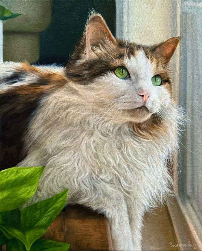 Close-up of an oil painting of a cat, featuring soft brushstrokes that capture the cat's fur texture, bright eyes, and detailed features