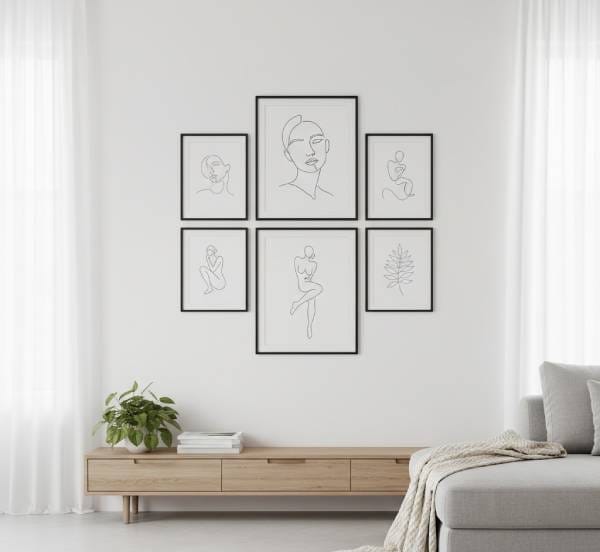 Minimalist line art gallery wall featuring elegant black and white figure drawings in modern frames, perfect for trendy wall decor and home art ideas.