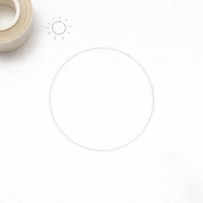 Step 2 of sphere drawing showing a basic circle with the light source direction marked above