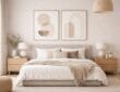 Creative use of minimalist art above a modern bed with neutral furniture and soft decor