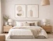 Creative use of minimalist art above a modern bed with neutral furniture and soft decor